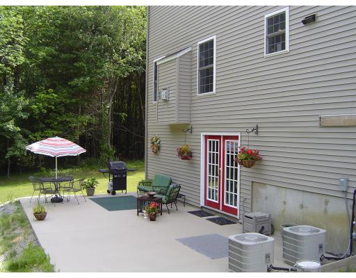 161 Rice Corner Road Brookfield, MA 01506 - Photo 5 of 28 a view of a patio with chairs and a table