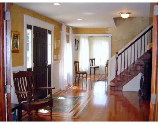 161 Rice Corner Road Brookfield, MA 01506 - Photo 7 of 28 a view of front door with dining room and wooden floor