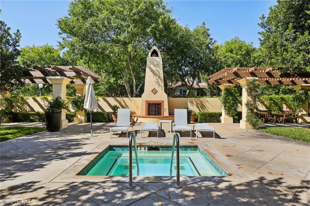 78 Windchime Irvine, CA 92603 - Photo 4 of 4 a wooden bench sitting in front of a building