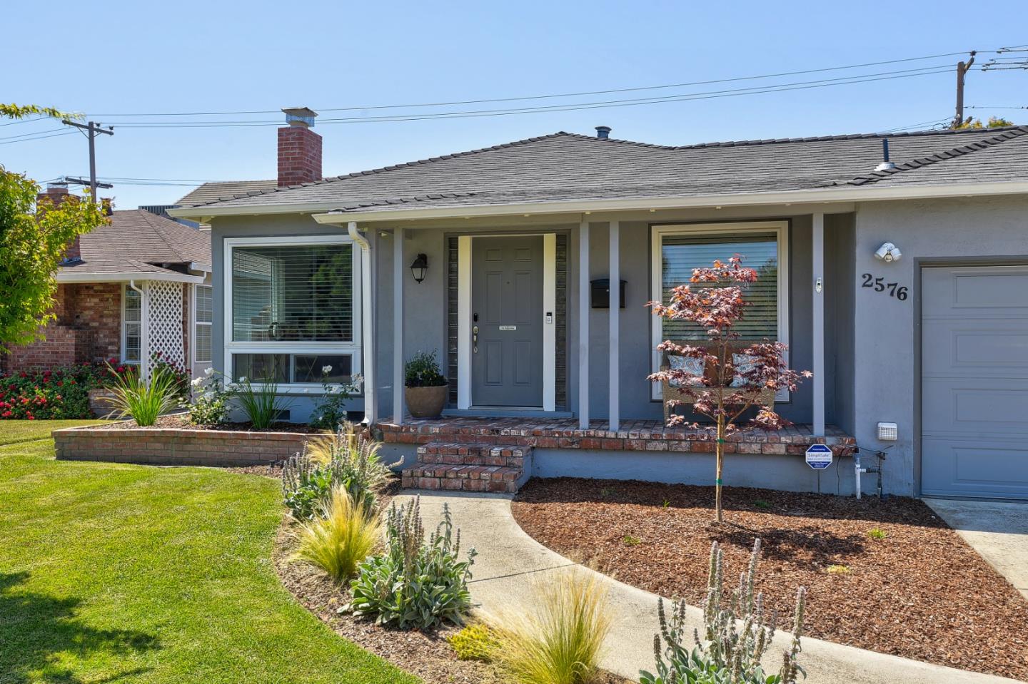 2576 Forest Avenue San Jose, CA 95050 - Photo 1 of 18 a front view of a house with swimming pool