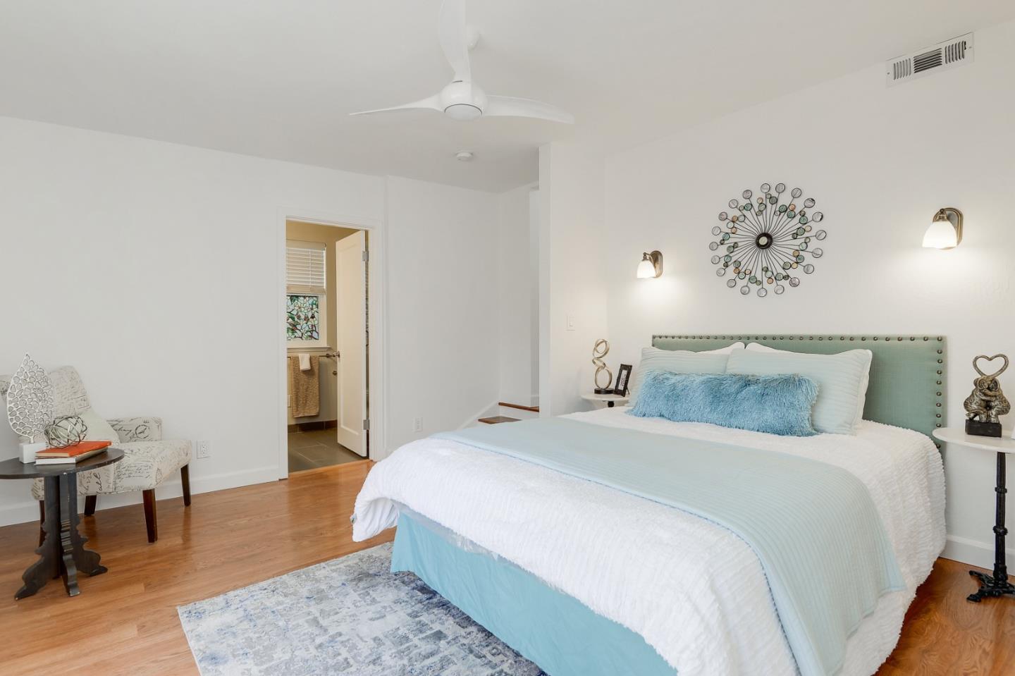 2576 Forest Avenue San Jose, CA 95050 - Photo 13 of 18 a bedroom with a bed and wooden floor