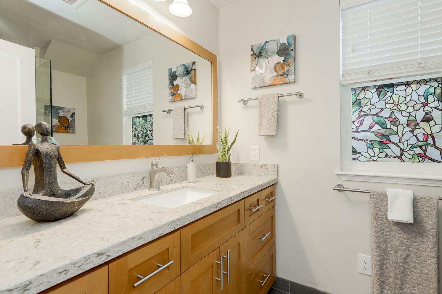 2576 Forest Avenue San Jose, CA 95050 - Photo 14 of 18 a bathroom with a sink and a mirror