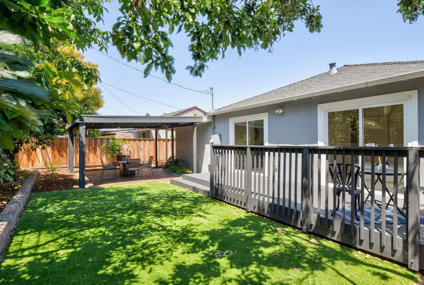 2576 Forest Avenue San Jose, CA 95050 - Photo 16 of 18 a view of a house with a backyard and wooden fence