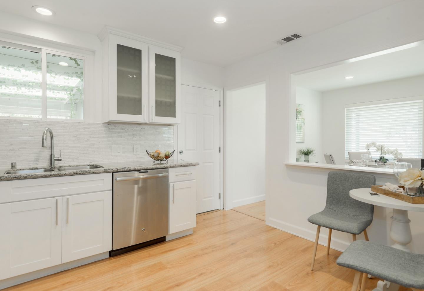 2576 Forest Avenue San Jose, CA 95050 - Photo 7 of 18 a kitchen with granite countertop white cabinets and sink