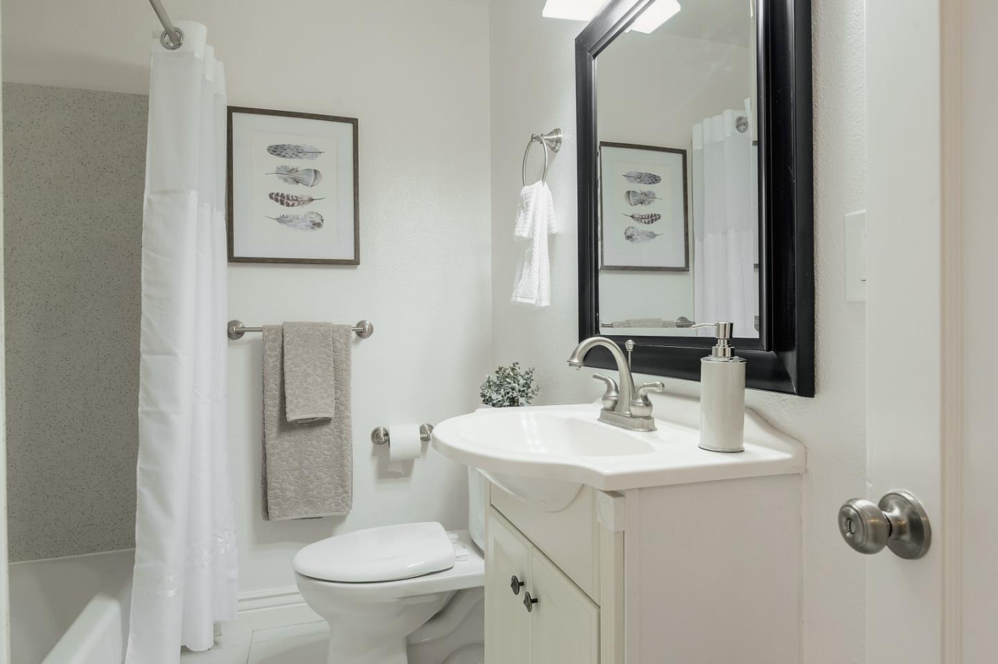 2576 Forest Avenue San Jose, CA 95050 - Photo 8 of 18 a bathroom with a toilet sink and mirror