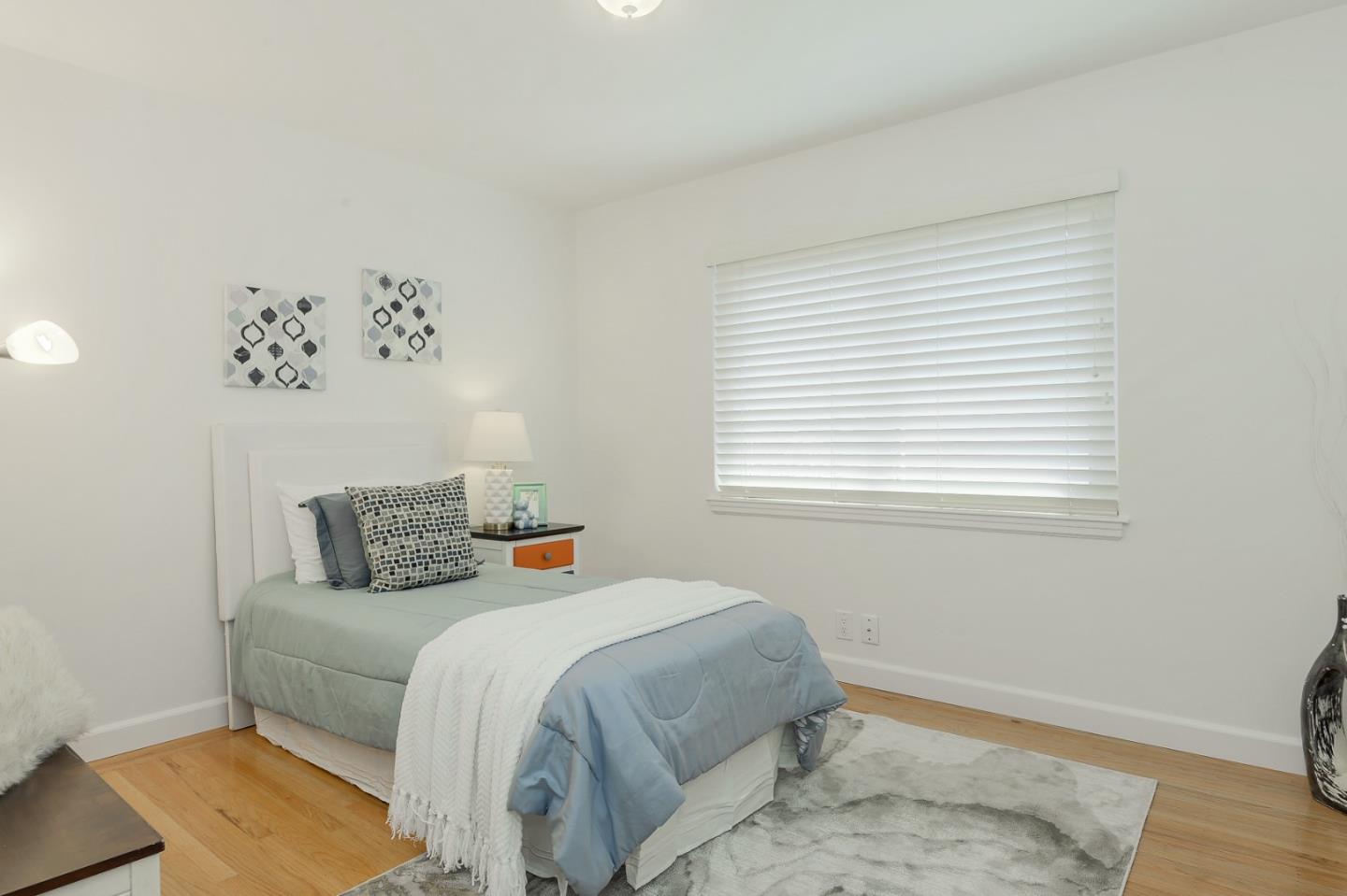 2576 Forest Avenue San Jose, CA 95050 - Photo 9 of 18 a bedroom with a bed and a window