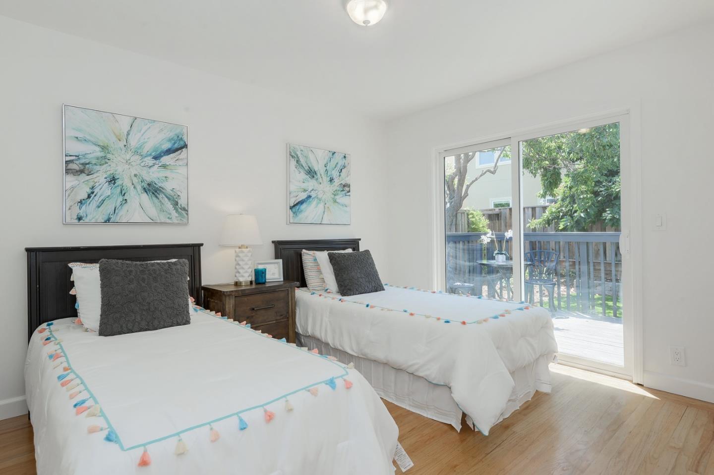 2576 Forest Avenue San Jose, CA 95050 - Photo 10 of 18 a bedroom with two beds and glass door