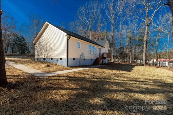 a view of a balcony with wooden floor and stairs