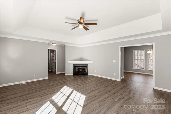 a kitchen with stainless steel appliances granite countertop wooden cabinets a stove top oven a sink and dishwasher