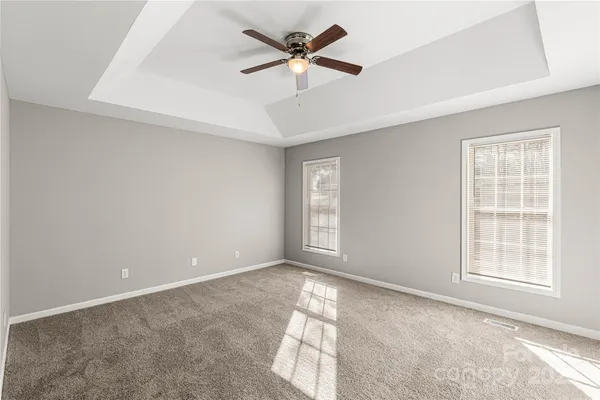 a view of room with a ceiling fan