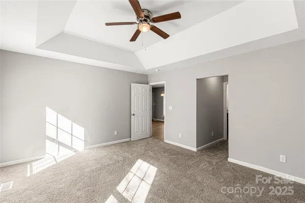 a bathroom with a granite countertop sink and a window