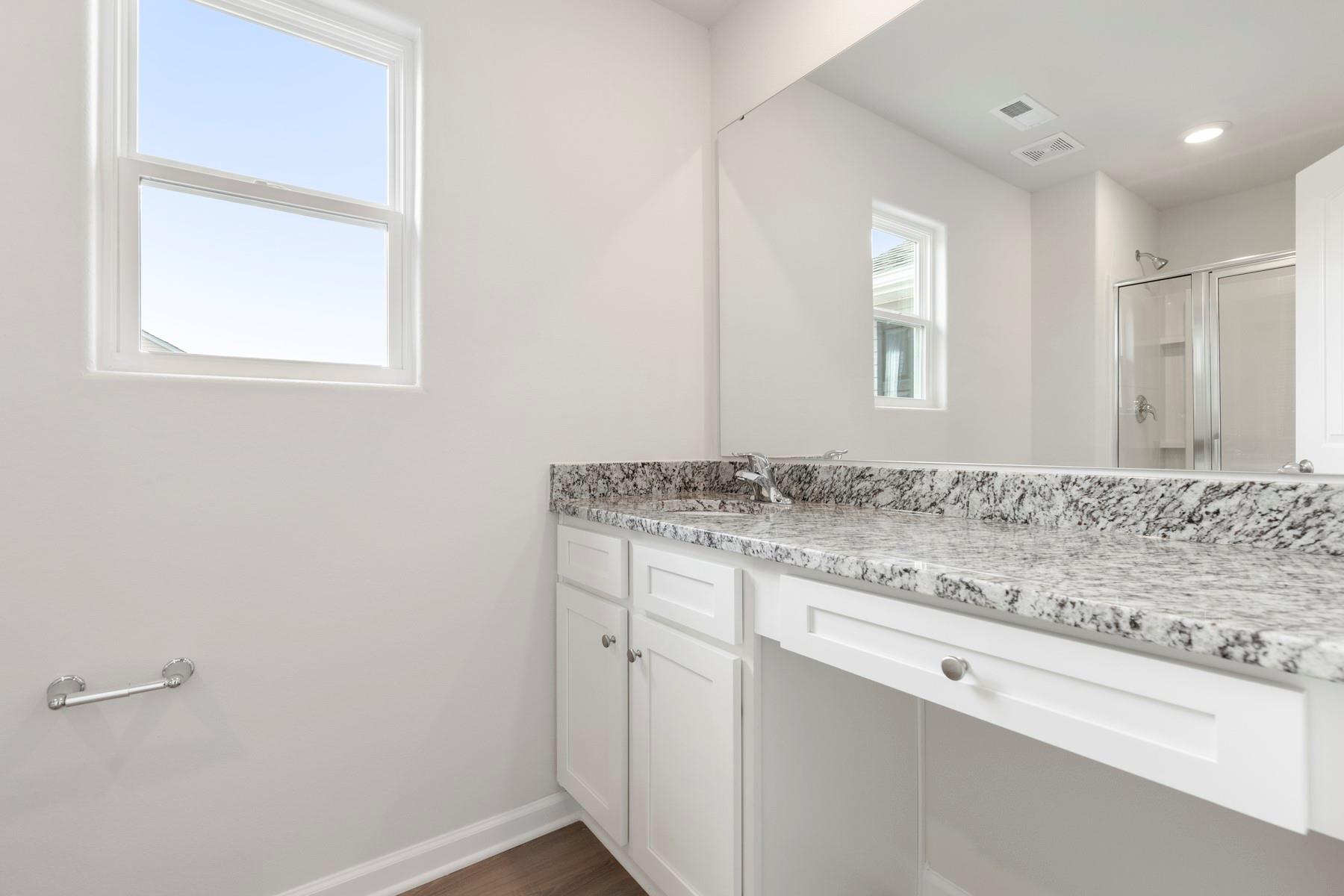 1405 Nia Road Charlotte, NC 28215 - Photo 13 of 16 a bathroom with a granite countertop sink and a mirror