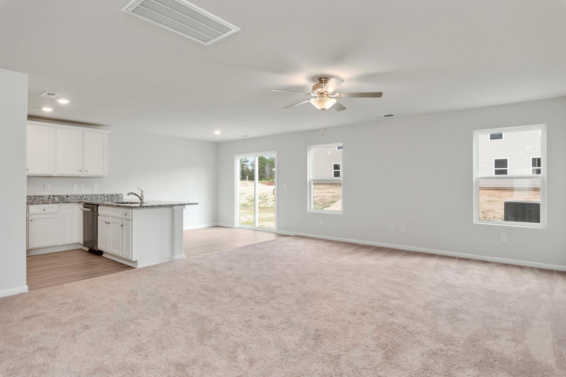 1405 Nia Road Charlotte, NC 28215 - Photo 3 of 16 a view of a kitchen with marble kitchen and a fireplace