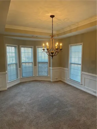 a view of empty room with windows