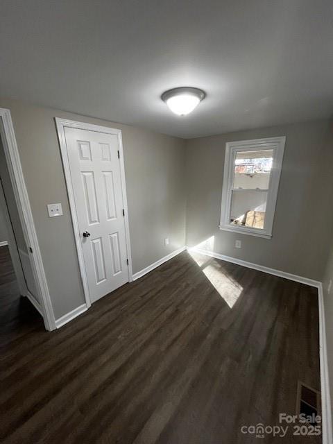 109 Lineview Drive Matthews, NC 28104 - Photo 9 of 16 an empty room with wooden floor and windows
