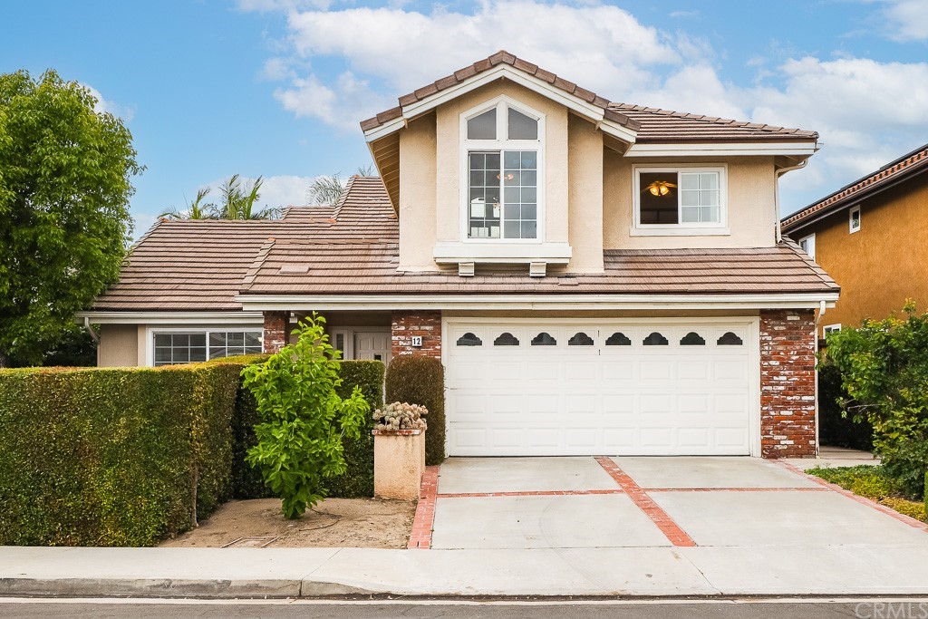 a view of a house with a yard and plants