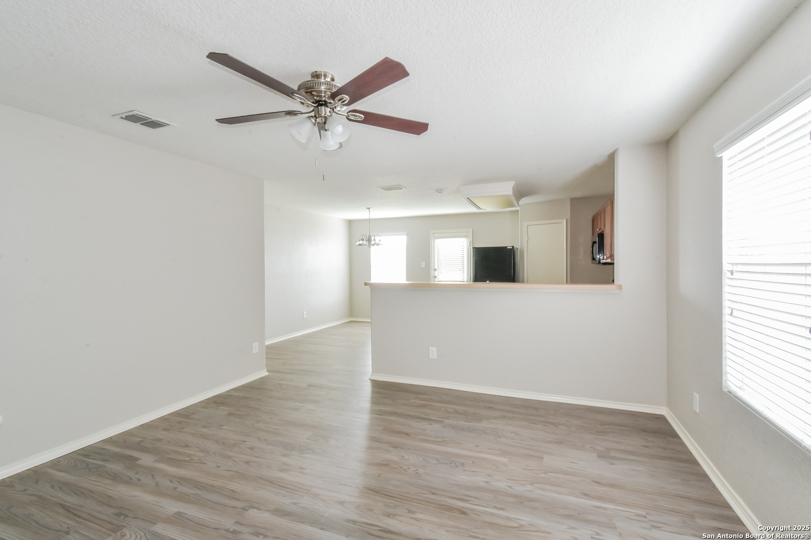 3603 Alonzo Fields Converse, TX 78109 - Photo 4 of 16 a view of empty room with wooden floor and fan