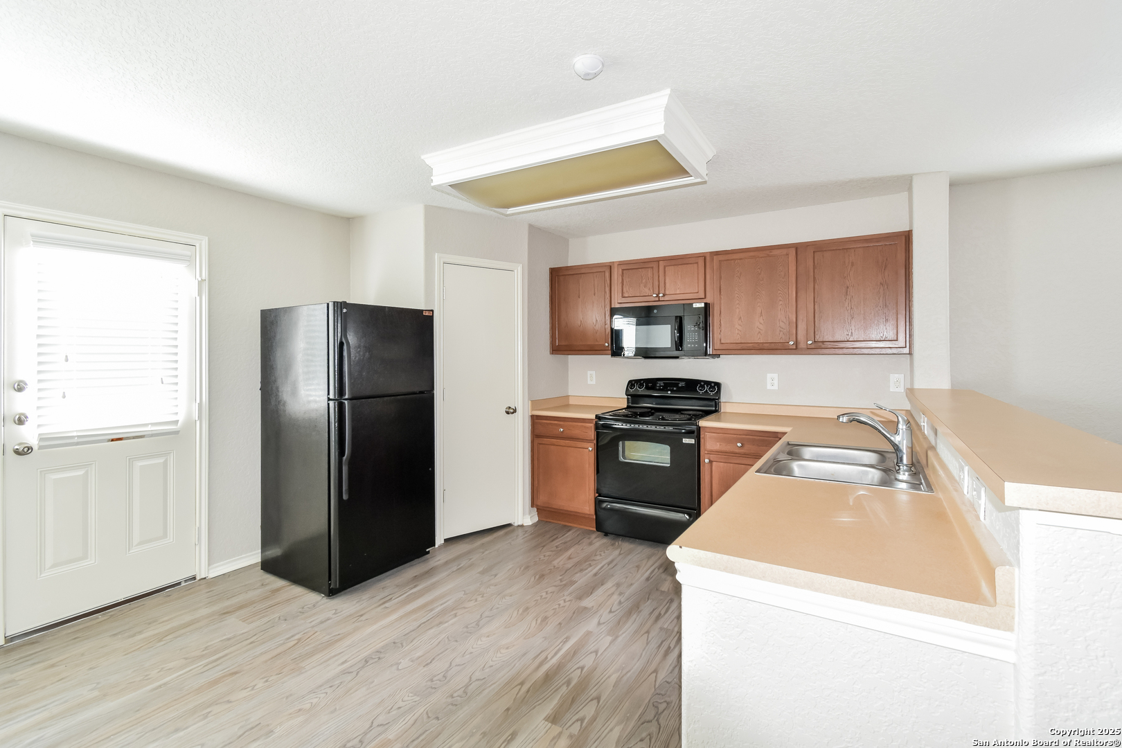 3603 Alonzo Fields Converse, TX 78109 - Photo 8 of 16 a kitchen with a refrigerator sink and microwave