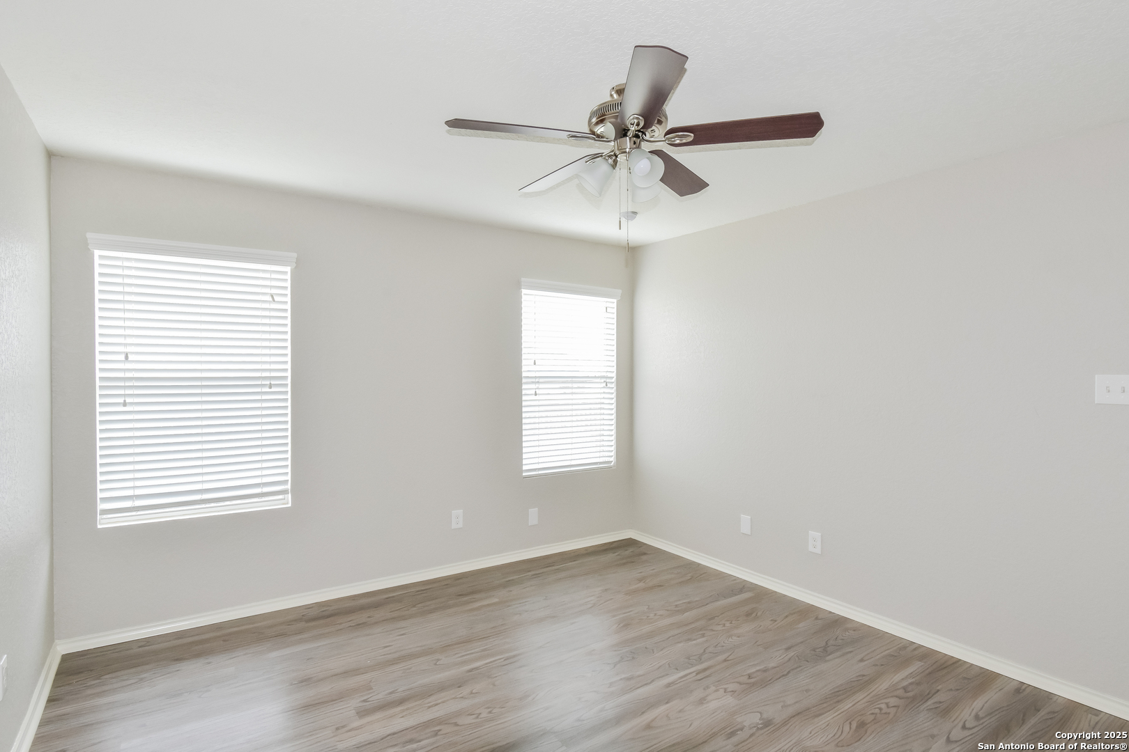 3603 Alonzo Fields Converse, TX 78109 - Photo 9 of 16 a view of a room with wooden floor and windows