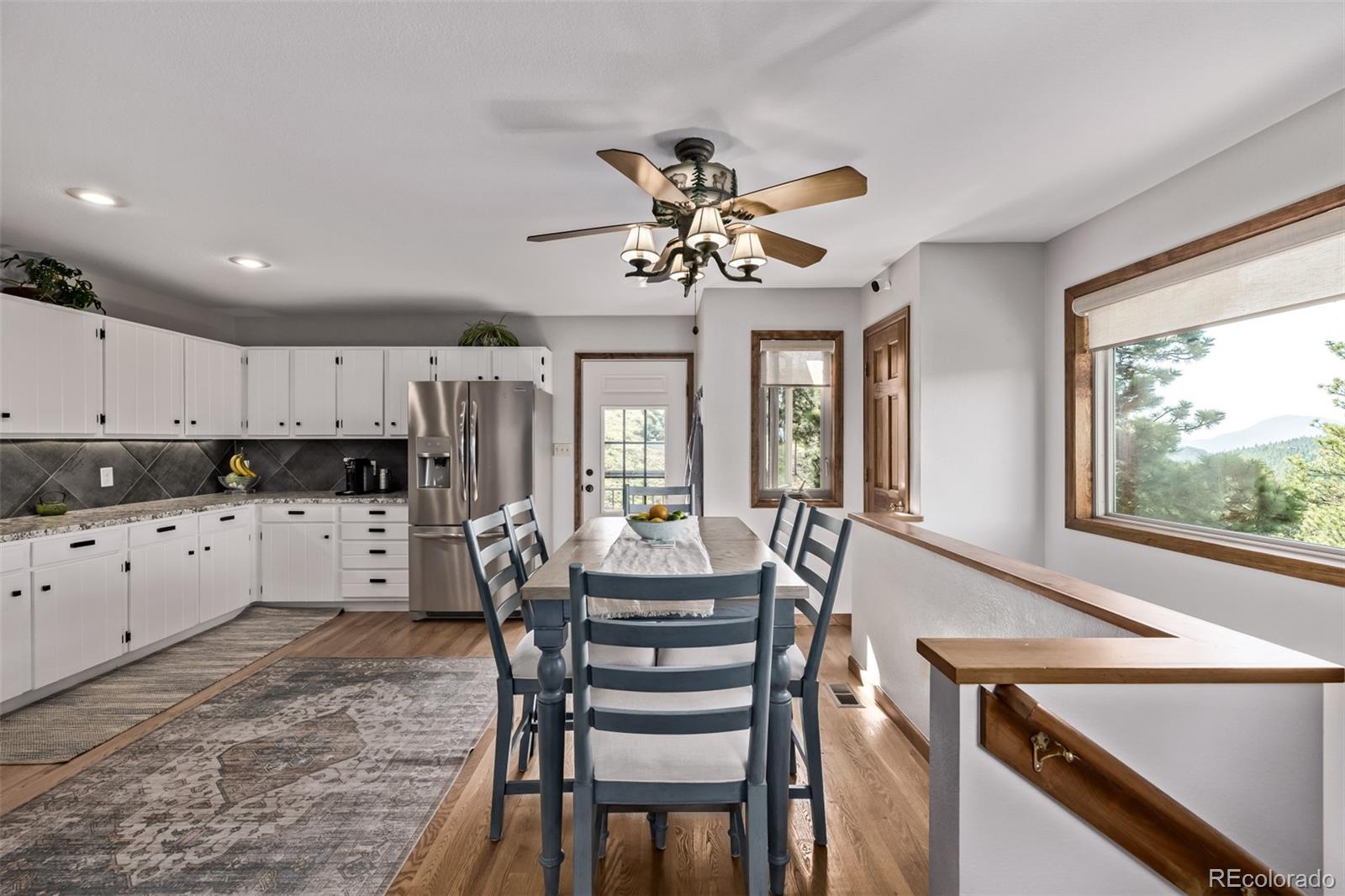 13950 Pine Valley Road Pine, CO 80470 - Photo 13 of 49 a view of a dining room with furniture window and outside view