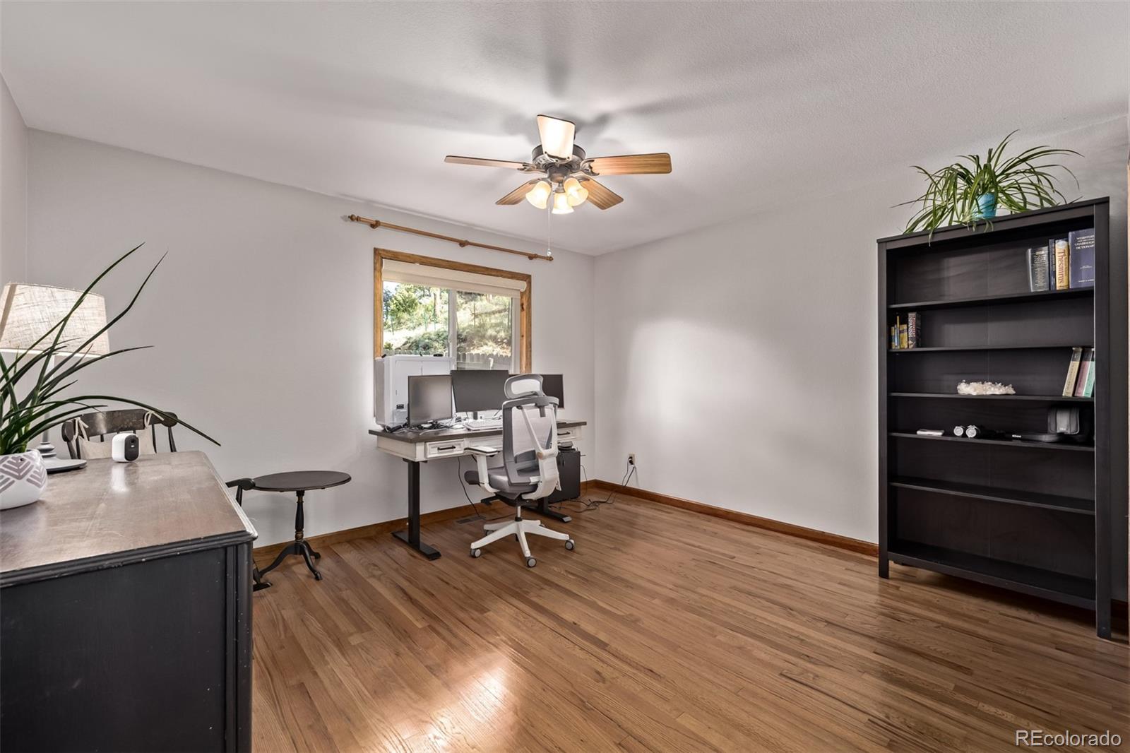 13950 Pine Valley Road Pine, CO 80470 - Photo 20 of 49 a view of a workspace with furniture and a window