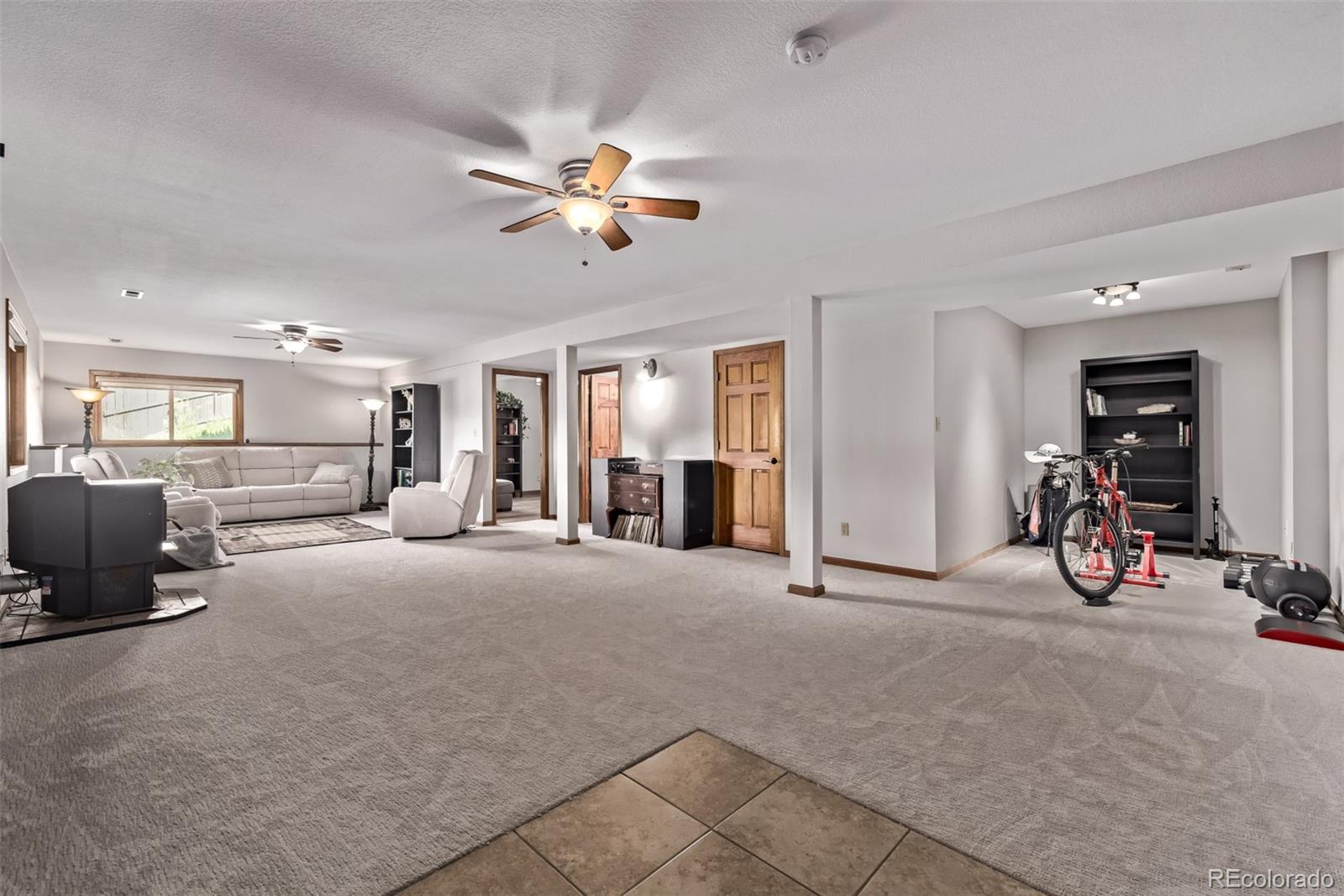 13950 Pine Valley Road Pine, CO 80470 - Photo 27 of 49 a view of a livingroom with furniture and a ceiling fan