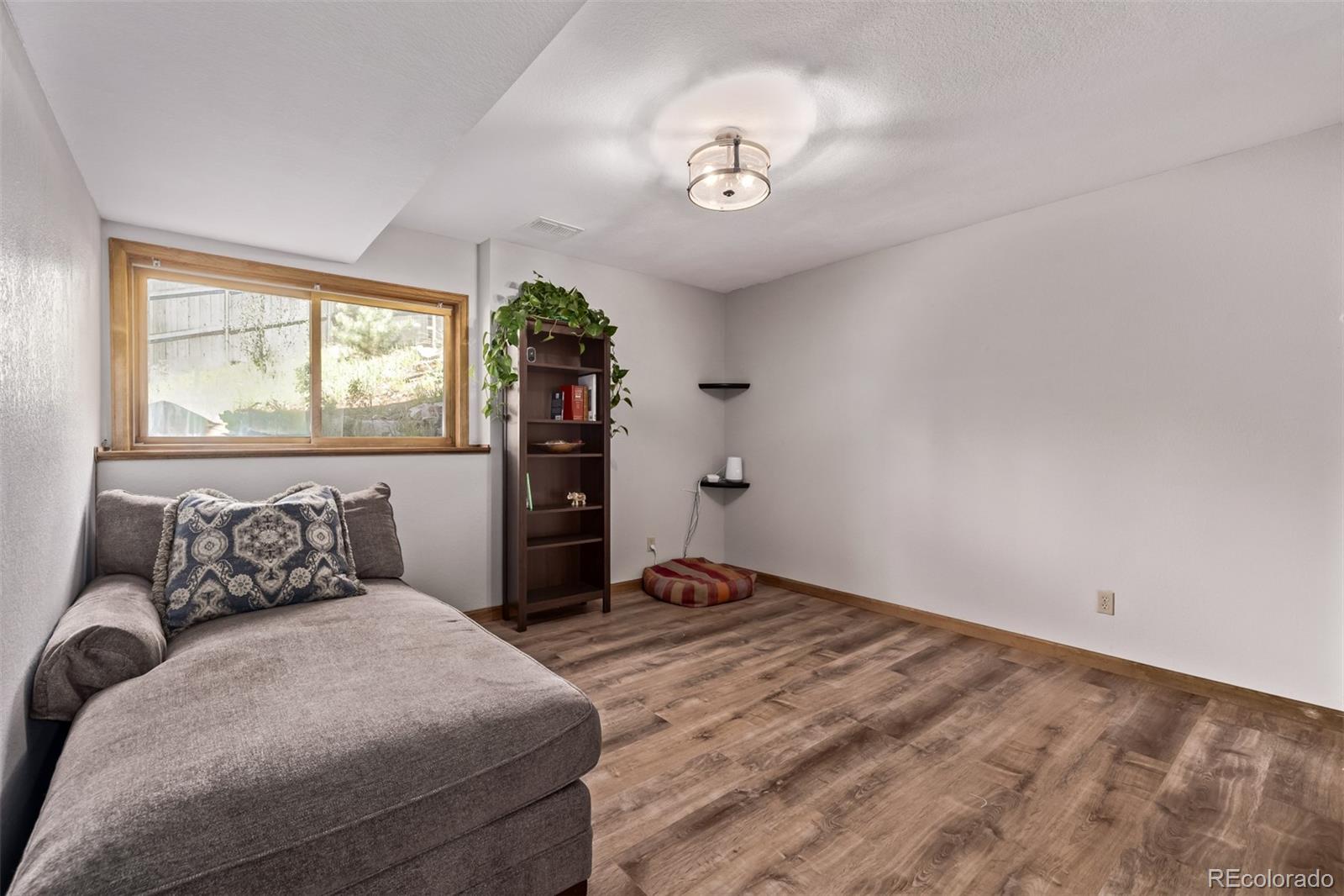 13950 Pine Valley Road Pine, CO 80470 - Photo 29 of 49 a bedroom with a bed and window