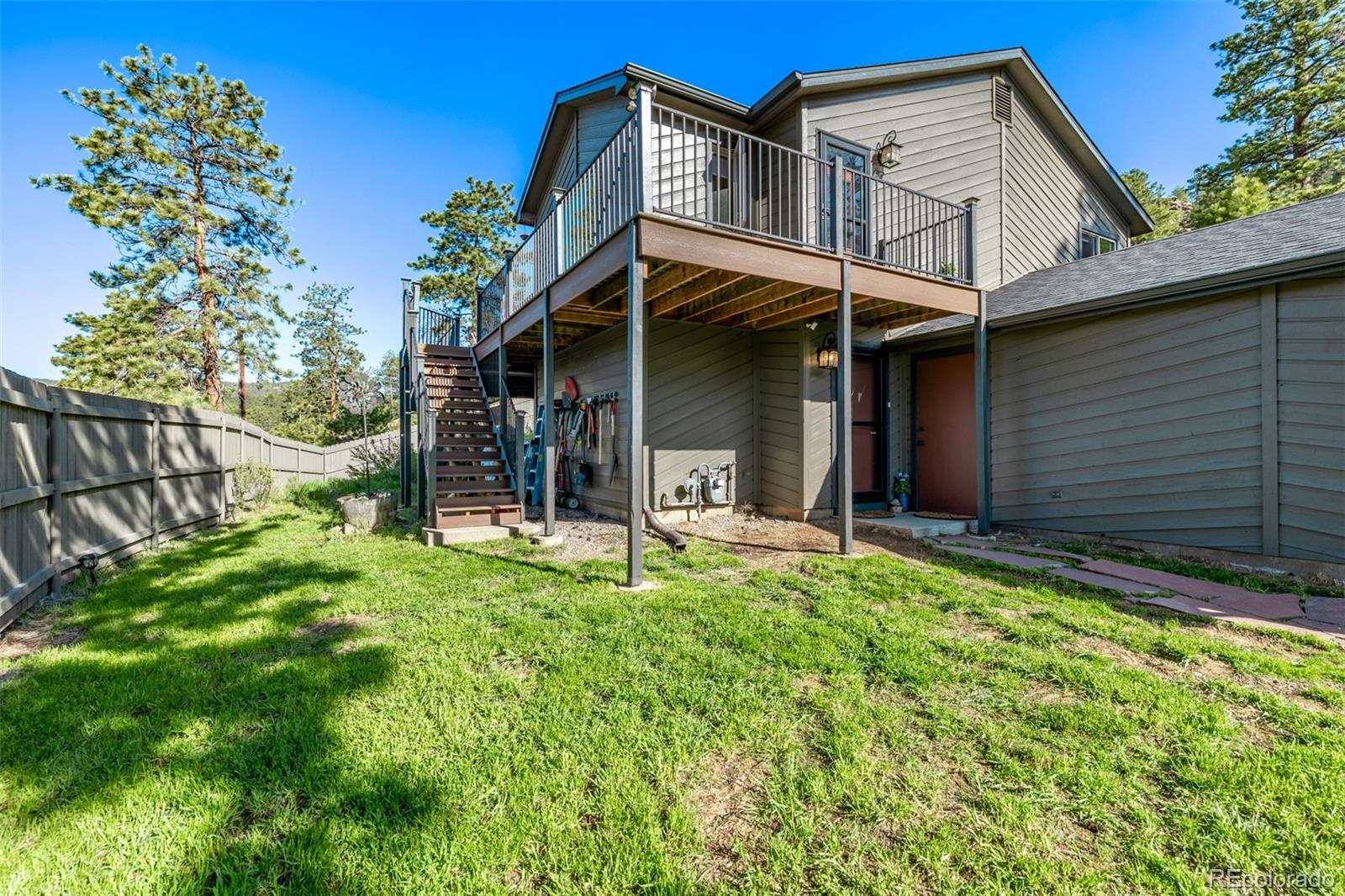 13950 Pine Valley Road Pine, CO 80470 - Photo 3 of 49 a view of a house with a yard