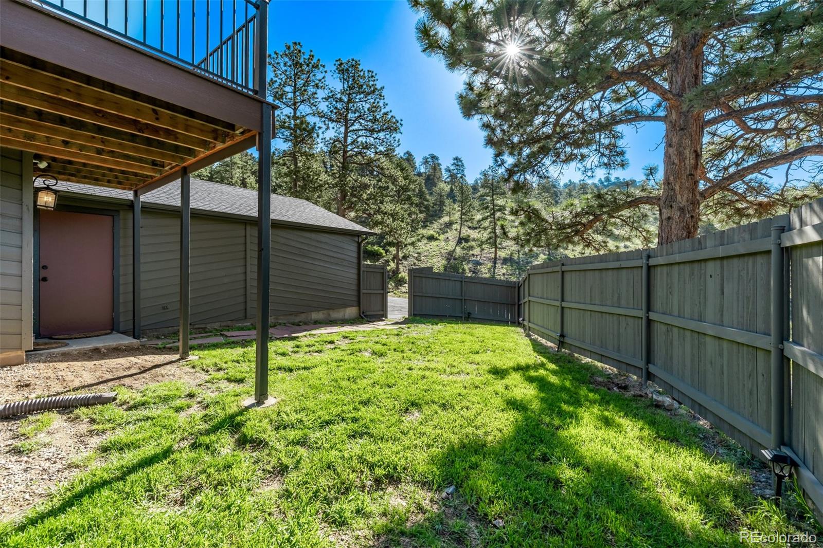 13950 Pine Valley Road Pine, CO 80470 - Photo 32 of 49 a backyard of a house