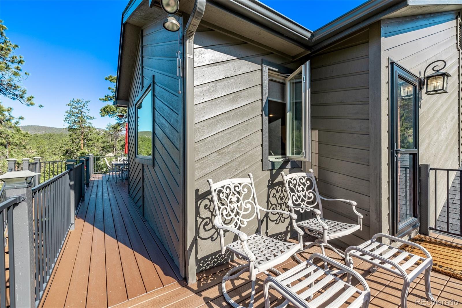13950 Pine Valley Road Pine, CO 80470 - Photo 35 of 49 a view of balcony with wooden floor