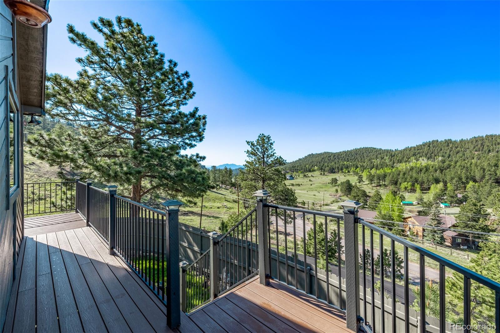 13950 Pine Valley Road Pine, CO 80470 - Photo 36 of 49 a view of a balcony with wooden floor