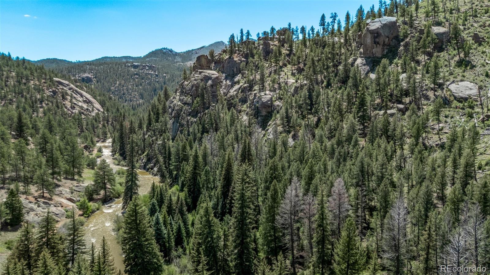 13950 Pine Valley Road Pine, CO 80470 - Photo 48 of 49 a view of a city with lush green forest