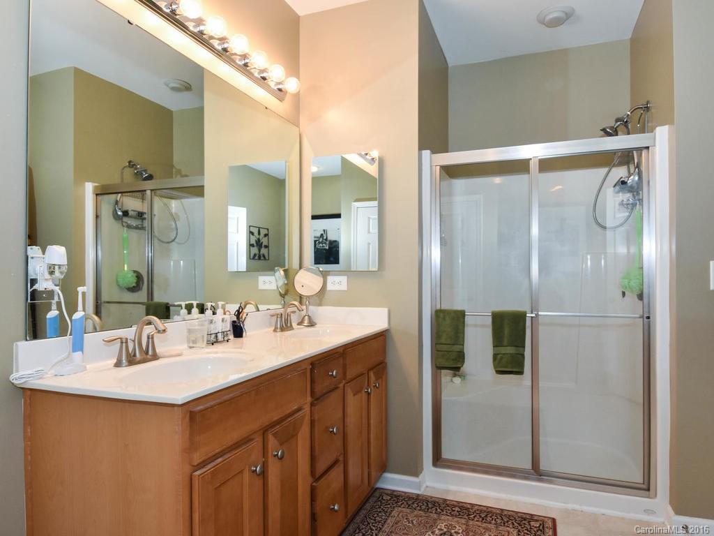 207 Garnet Court, Unit 561 Fort Mill, SC 29708 - Photo 13 of 21 a bathroom with a sink and a mirror