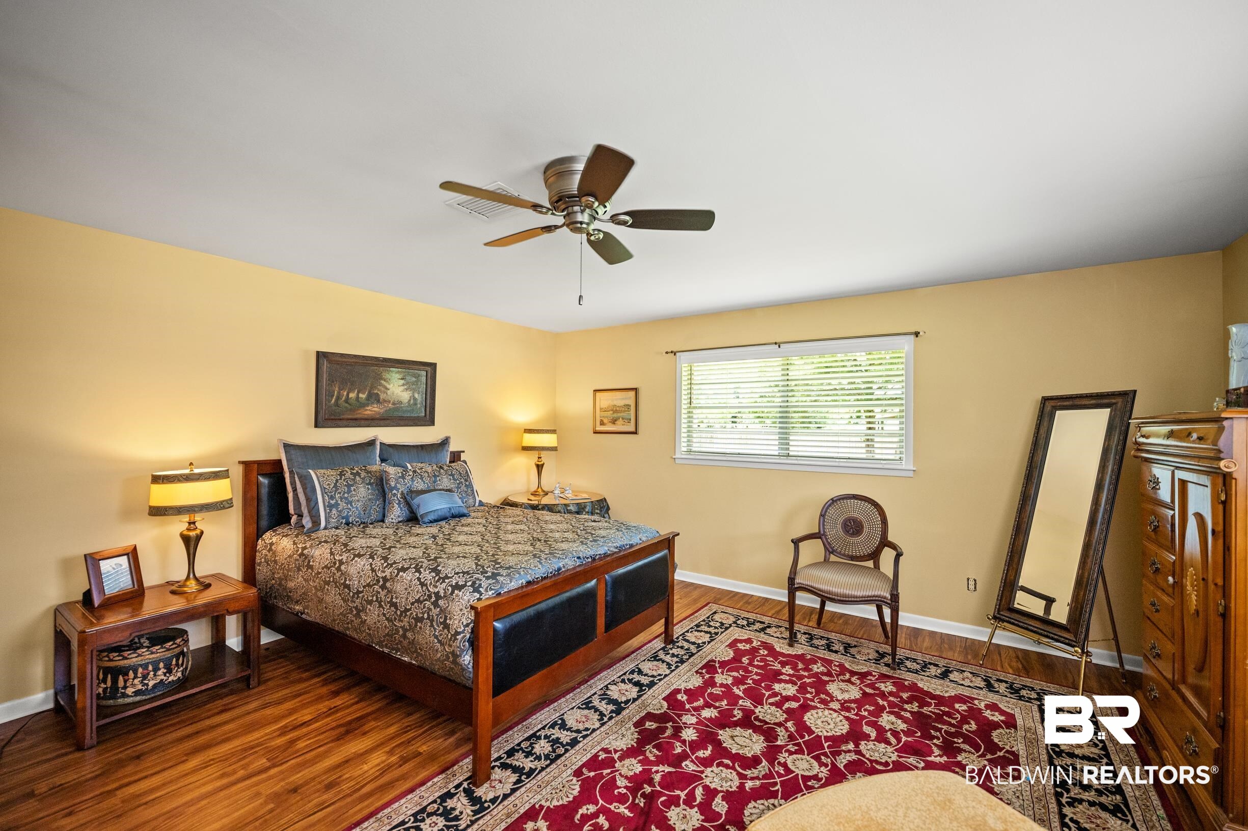 56 Old Bratt Road Atmore, AL 36502 - Photo 25 of 37 Bedroom with wood finished floors, baseboards, and ceiling fan