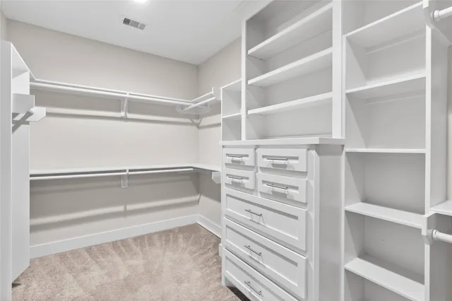 a view of an empty walk in closet