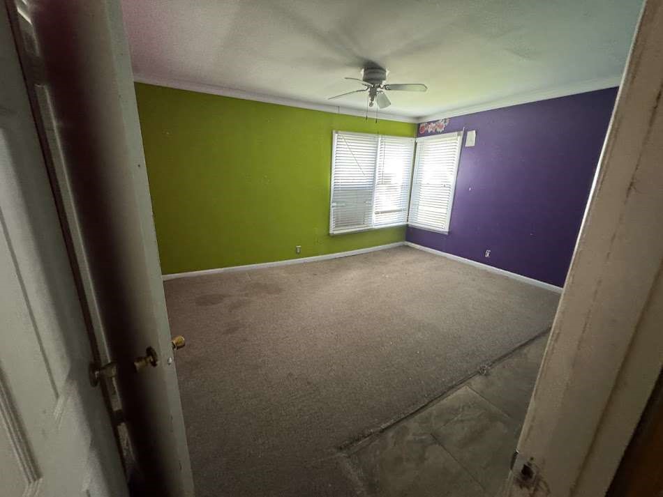 905 Euclid Street Cleburne, TX 76033 - Photo 11 of 15 a view of empty room with window and hardwood floor