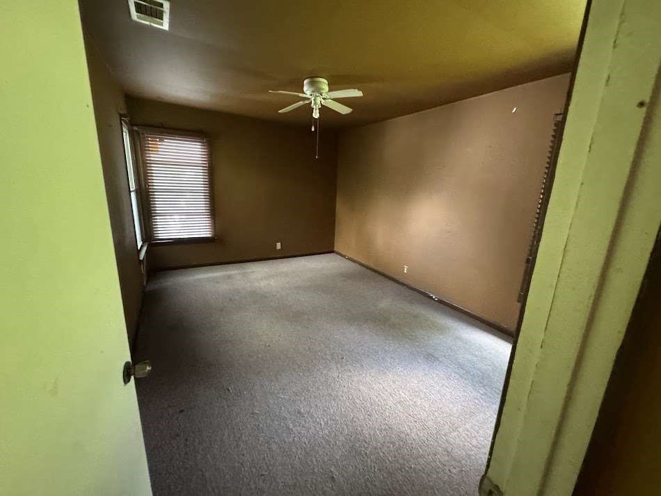 905 Euclid Street Cleburne, TX 76033 - Photo 12 of 15 a view of an empty room with a window