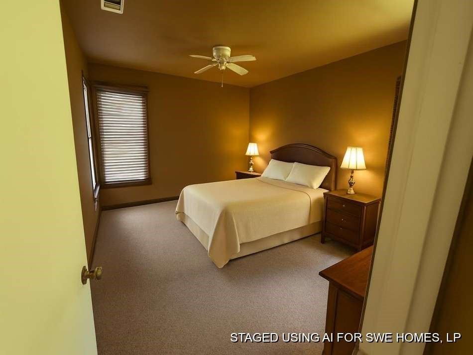 905 Euclid Street Cleburne, TX 76033 - Photo 13 of 15 a bedroom with a bed and a lamp with potted plant