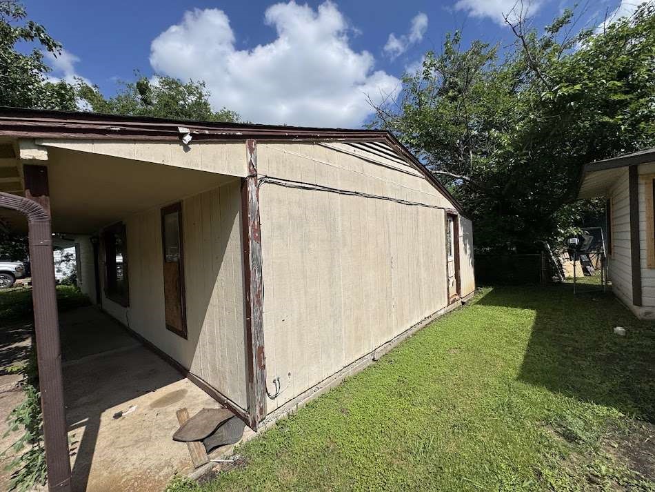 905 Euclid Street Cleburne, TX 76033 - Photo 14 of 15 a view of backyard with cabin