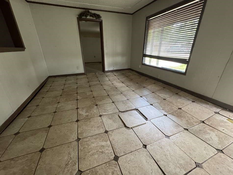 905 Euclid Street Cleburne, TX 76033 - Photo 6 of 15 a view of an empty room with a window