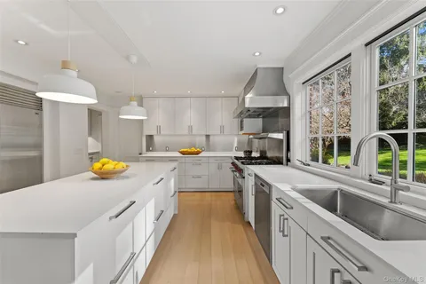 a kitchen with a sink and counter top