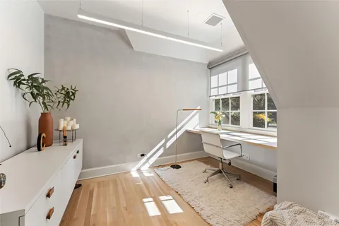 a workspace with furniture and a window