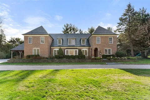 a front view of a house with swimming pool