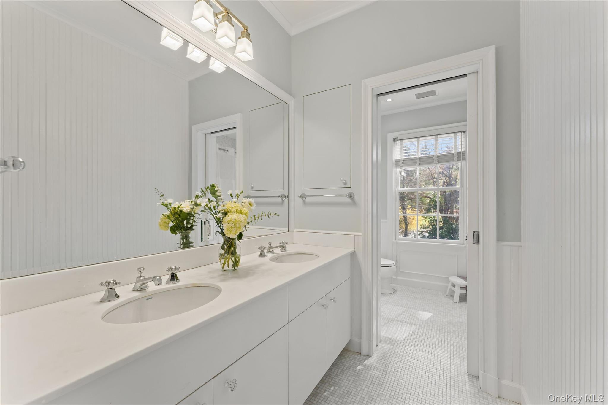 50 Greendale Road Scarsdale, NY 10583 - Photo 23 of 34 a bathroom with a sink a vanity and a mirror