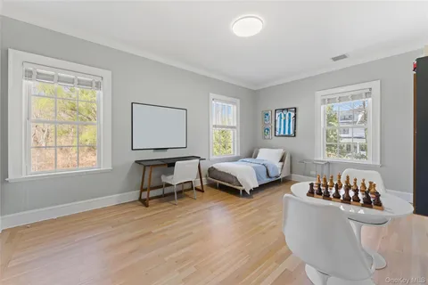 a bedroom with furniture and a window