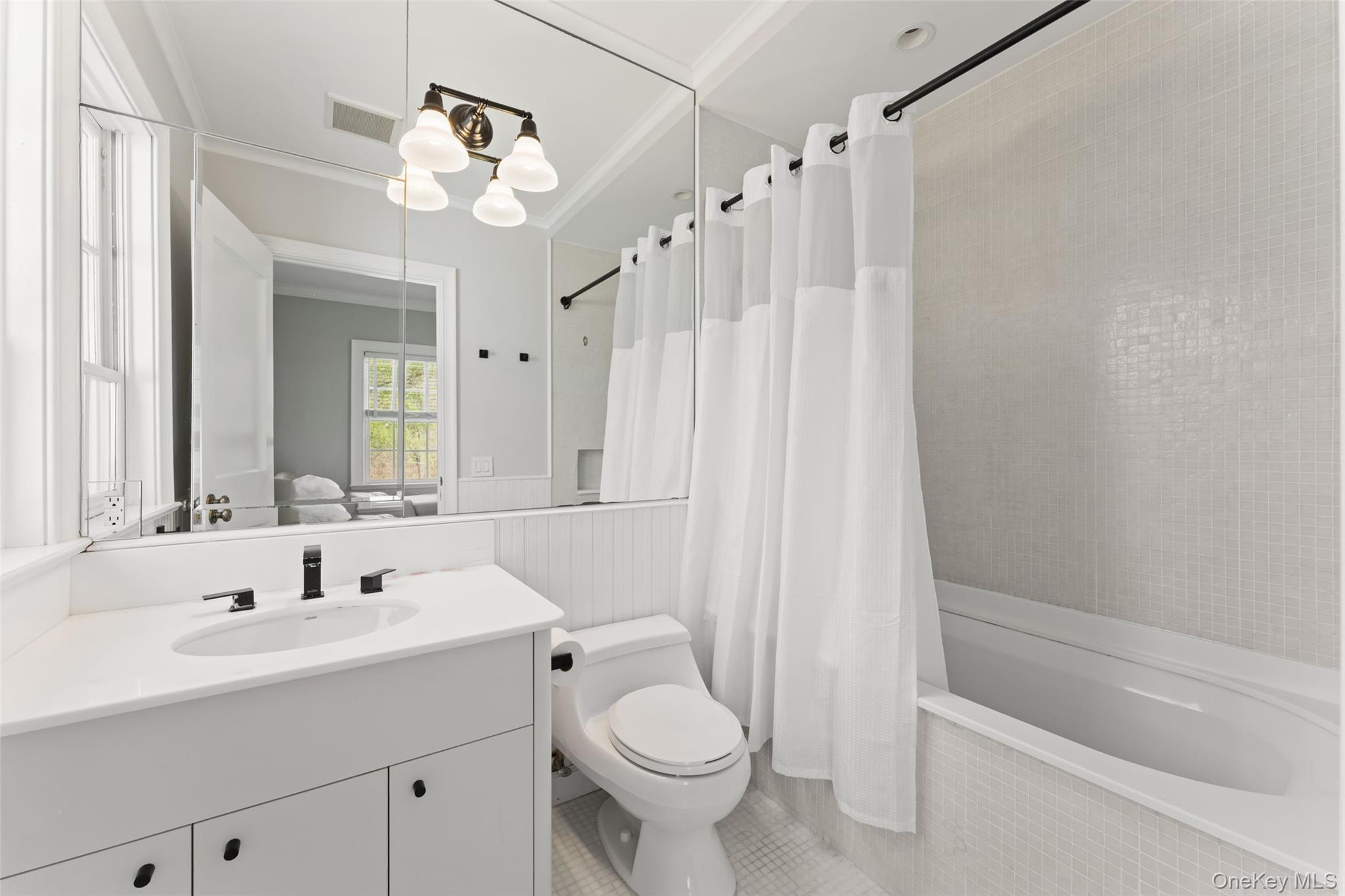 50 Greendale Road Scarsdale, NY 10583 - Photo 26 of 34 a bathroom with a sink a toilet and shower