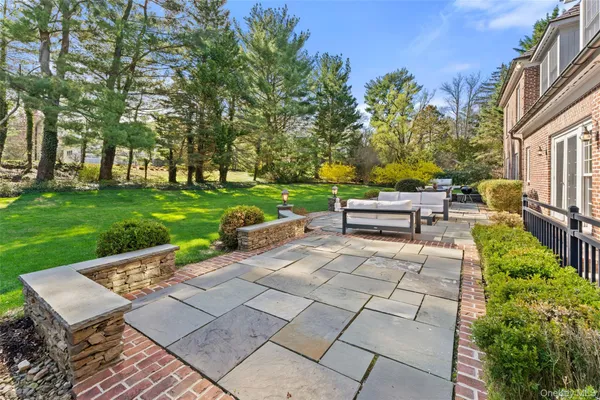 a view of backyard with seating area and green space
