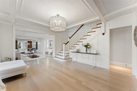 a view of a livingroom with furniture and chandelier