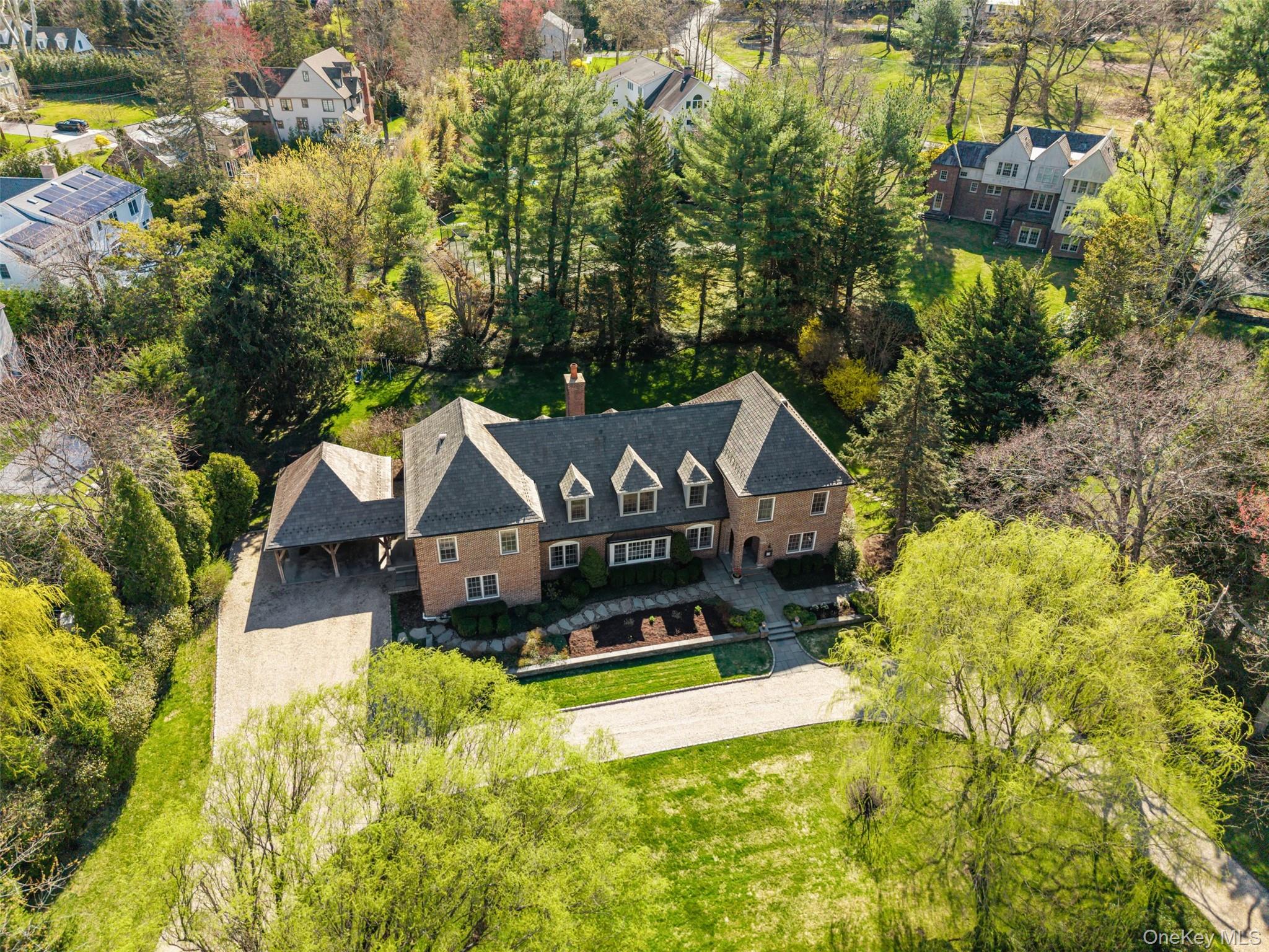 50 Greendale Road Scarsdale, NY 10583 - Photo 31 of 34 a aerial view of a house with a big yard and large trees