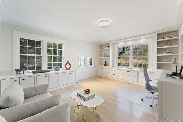 a living room with furniture and window with outer view
